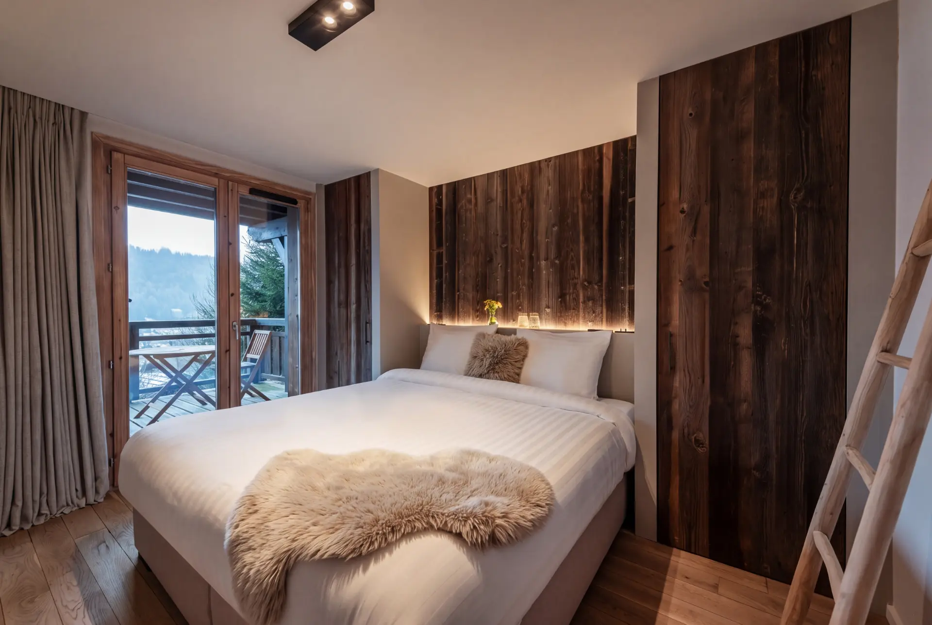 Bedroom with dark oak panelling and a wide valley window